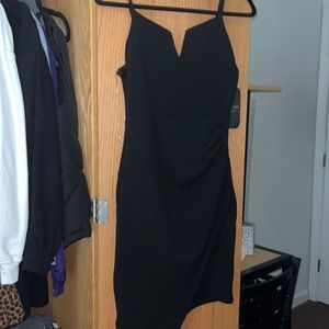 Black asymmetrical v neck dress